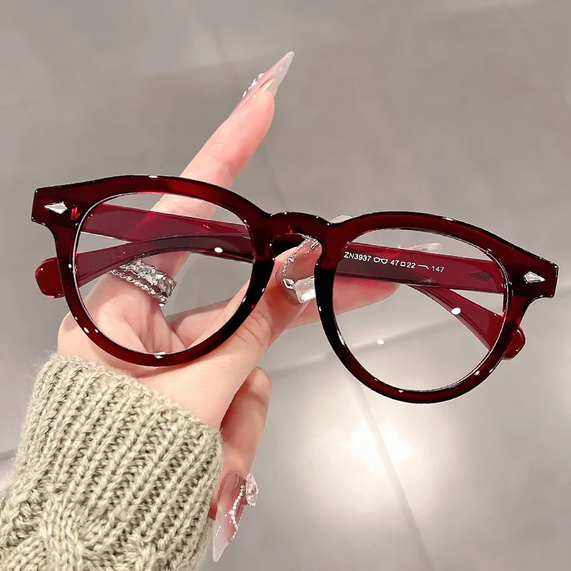 A high-end, retro Korean-style round frame anti-blue light flat glasses with a simple round frame and rice studs without makeup